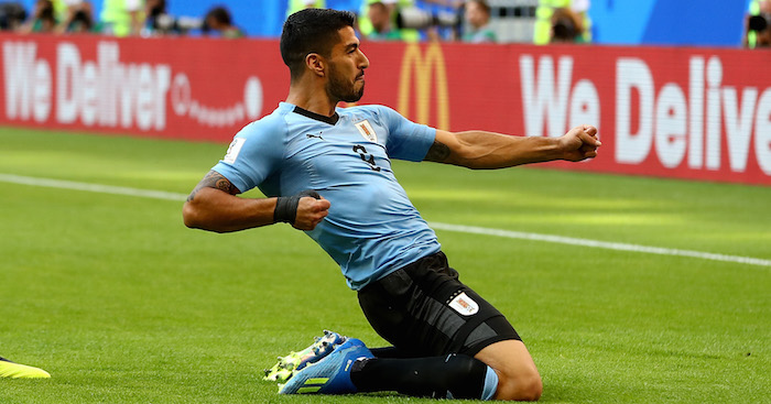 Uruguay 3-0 Russia: Suarez, Cavani help steal top spot