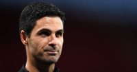 Arsenal boss Mikel Arteta smiles