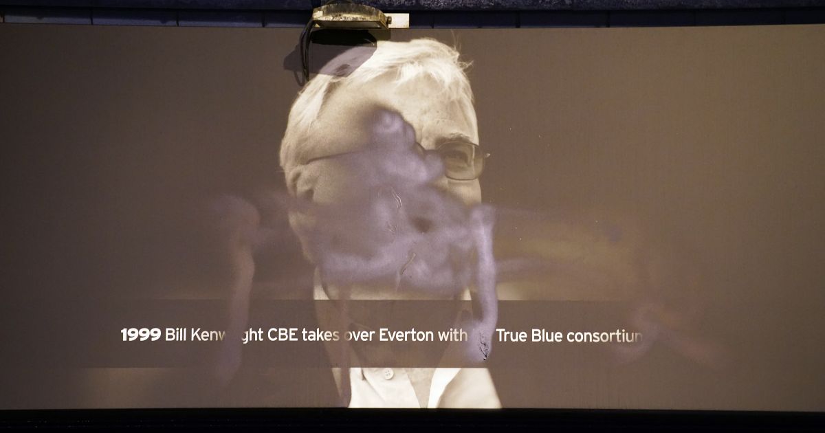A defaced poster of chairman Everton Bill Kenwright