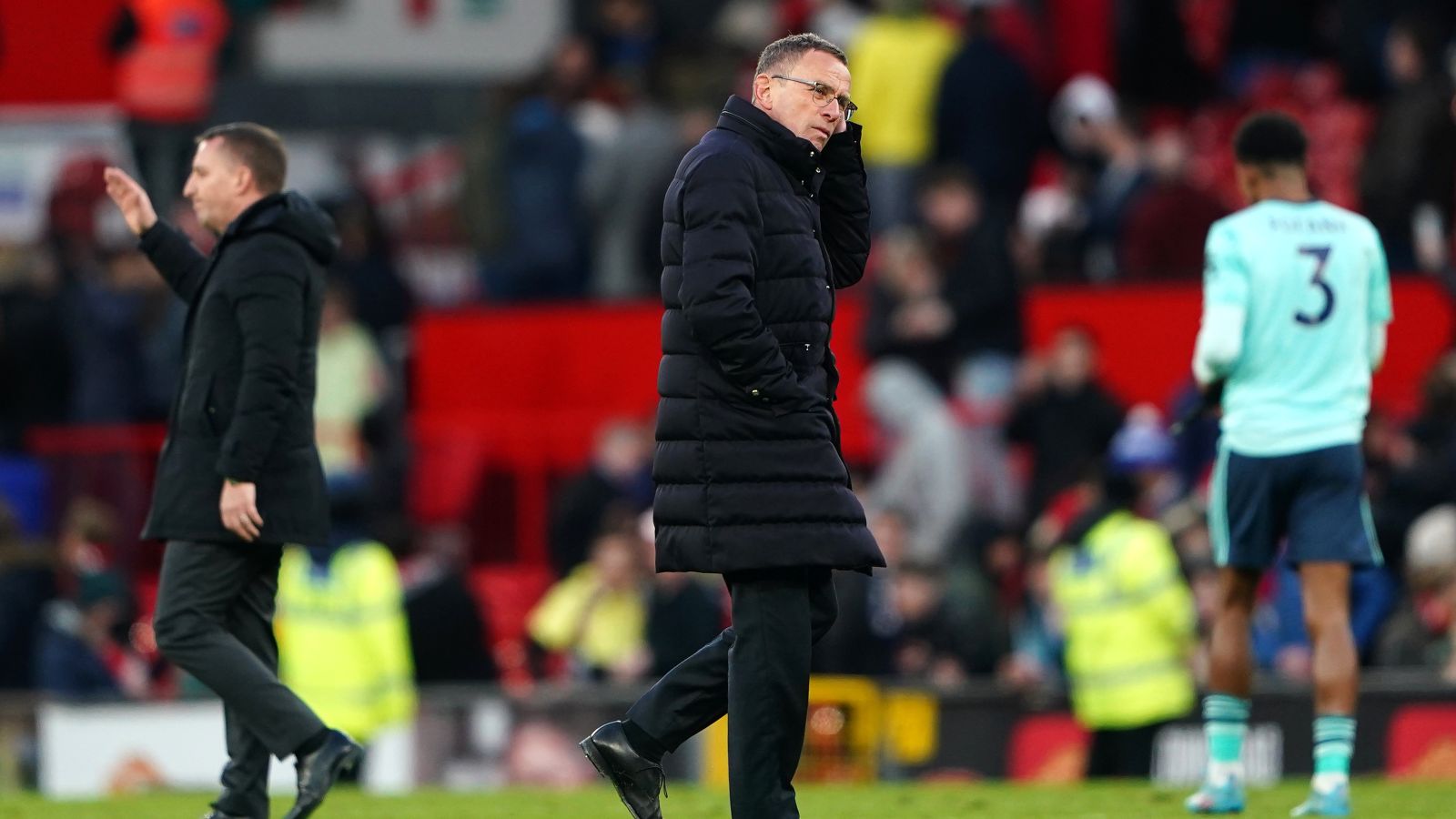 Man Utd boss Ralf Rangnick scratches his head as he walks off the pitch
