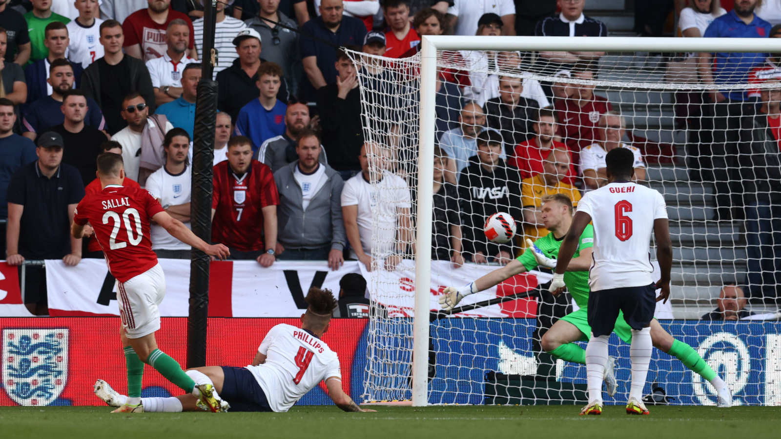Roland Sallai shoots past Aaron Ramsdale to score for Hungary against England