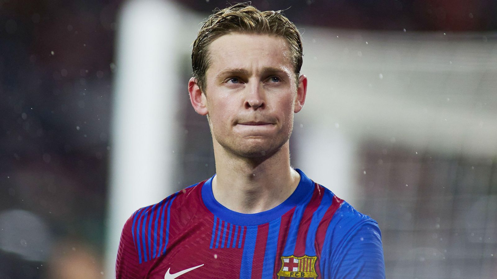 Man Utd target Frenkie de Jong looks up into the stands