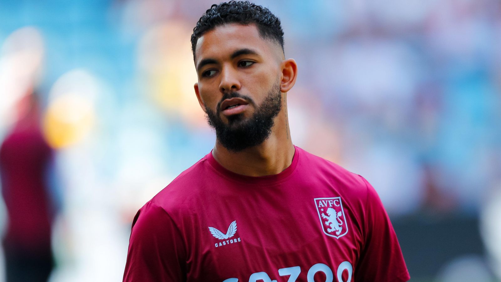 Douglas Luiz warms up before an Aston Villa game.