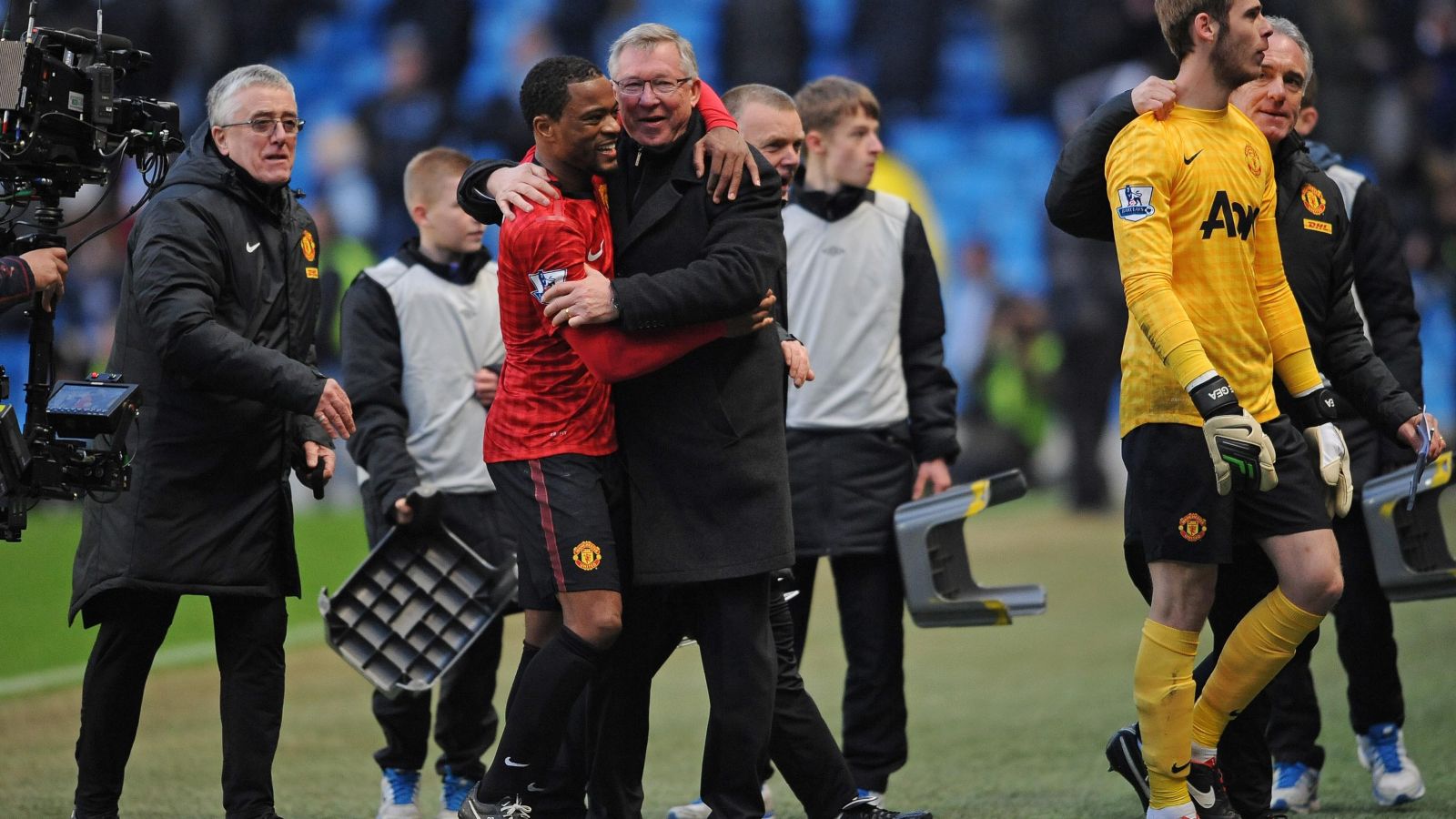 Man Utd defender Patrice Evra hugs Sir Alex Ferguson