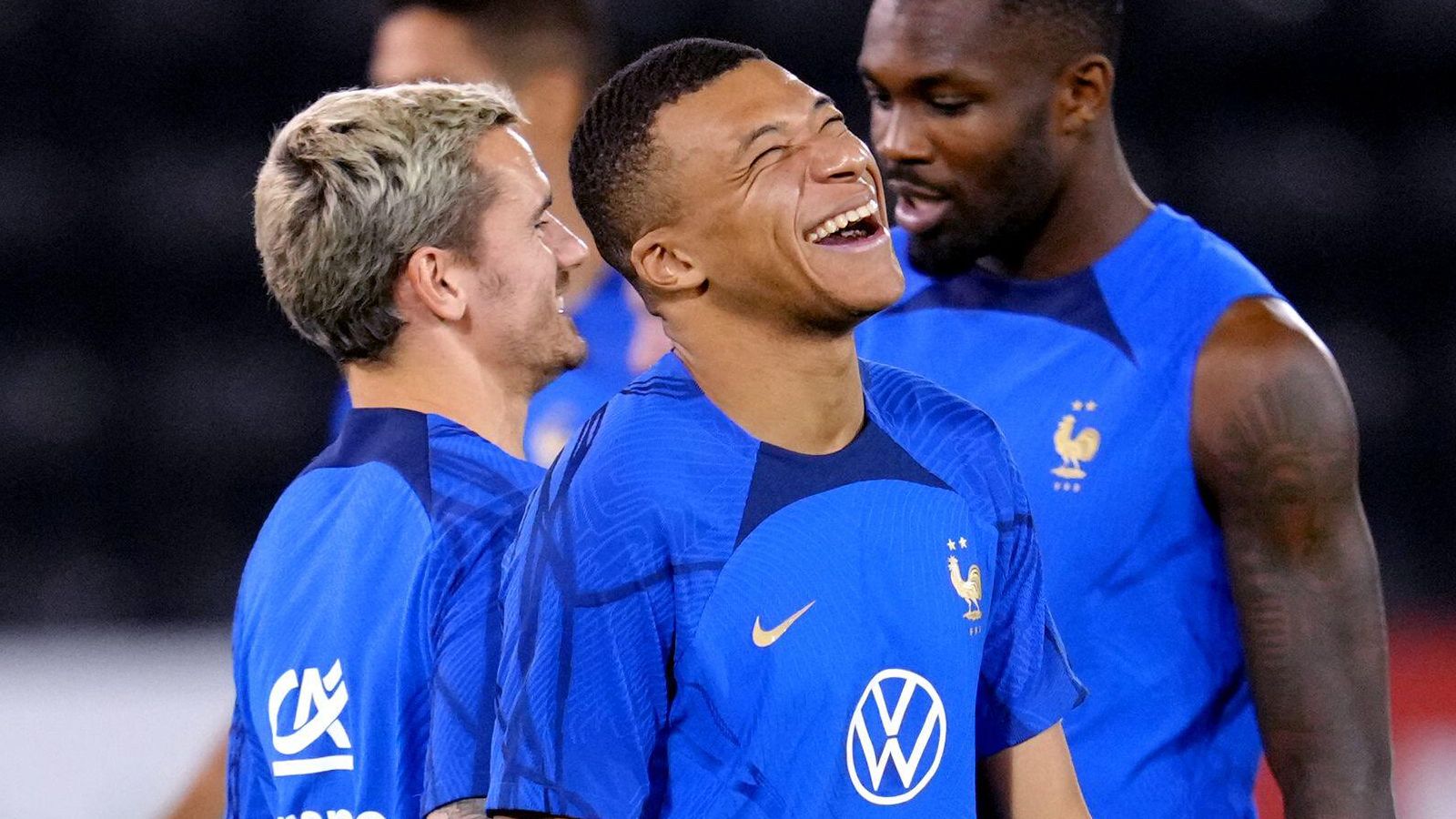 Kylian Mbappe laughs