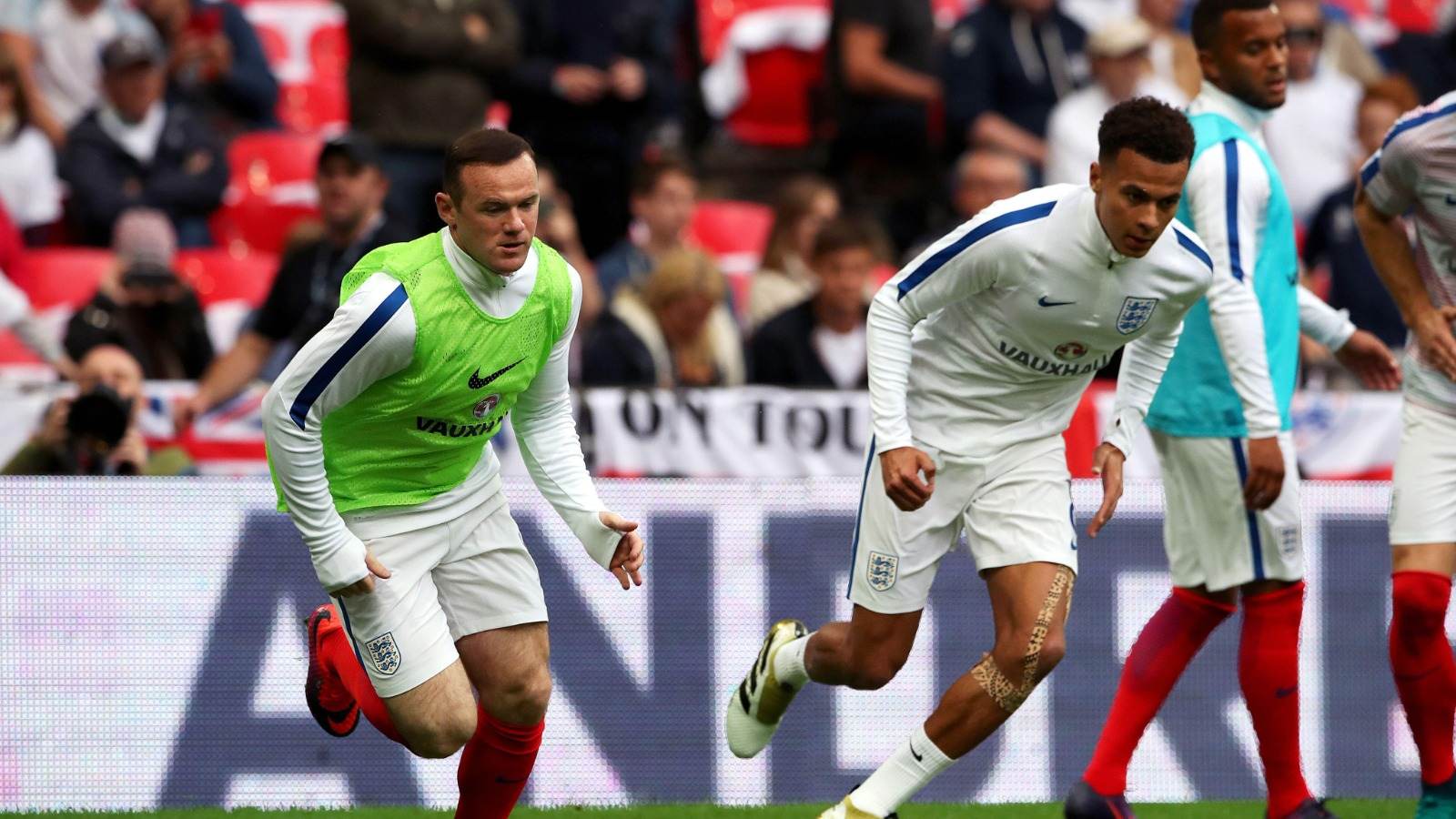 Wayne Rooney warms up with Dele before an England game, 2016