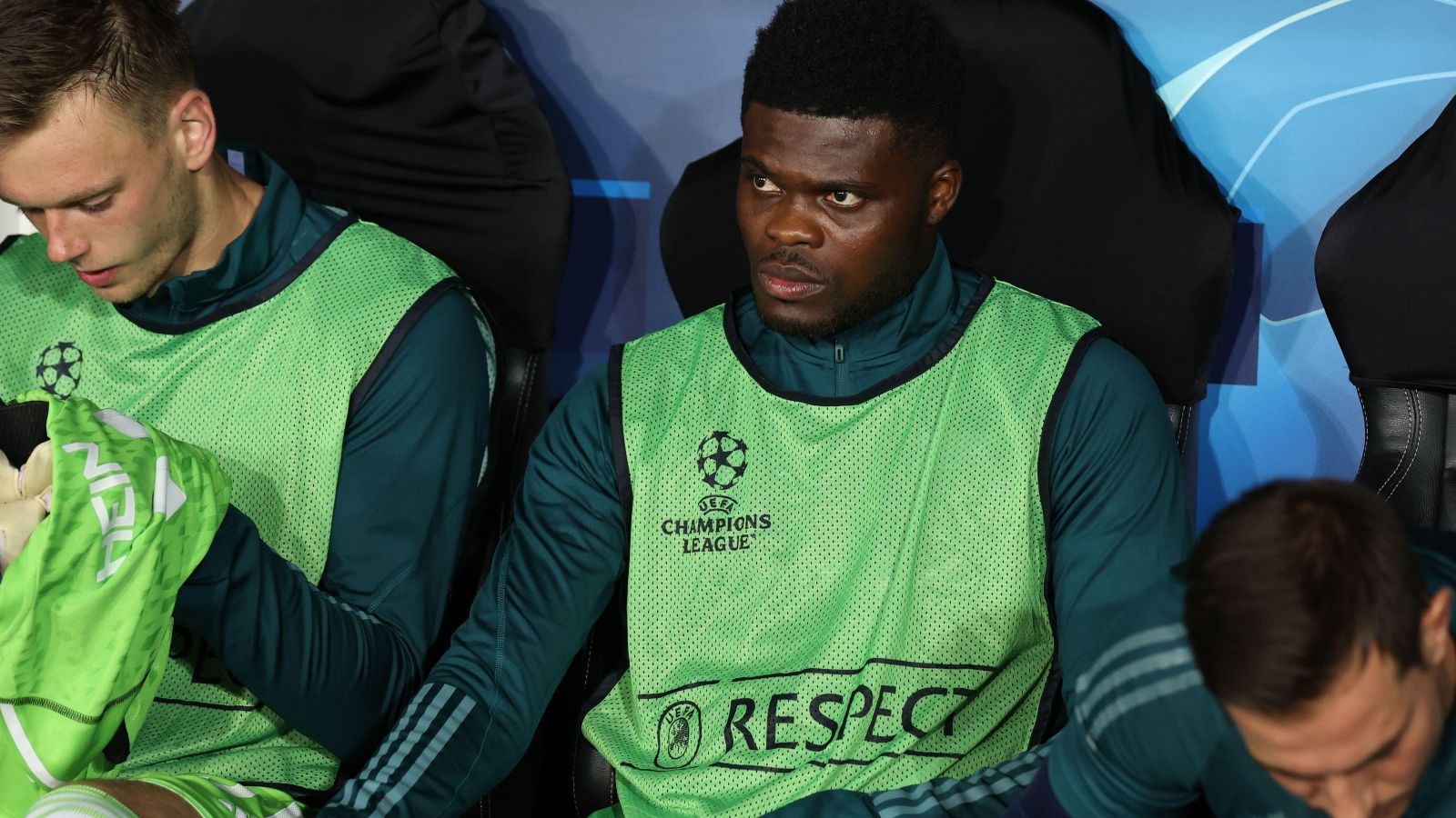 Arsenal midfielder Thomas Partey sitting on the bench before a match.