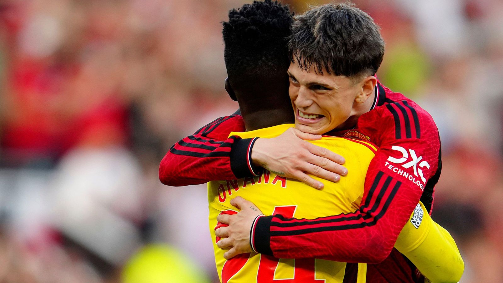 Manchester United winger Alejandro Garnacho hugs Andre Onana.