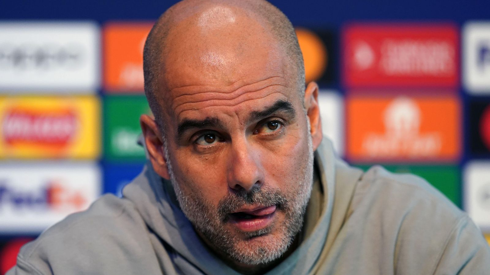Manchester City manager Pep Guardiola discusses Erling Haaland during a press conference.