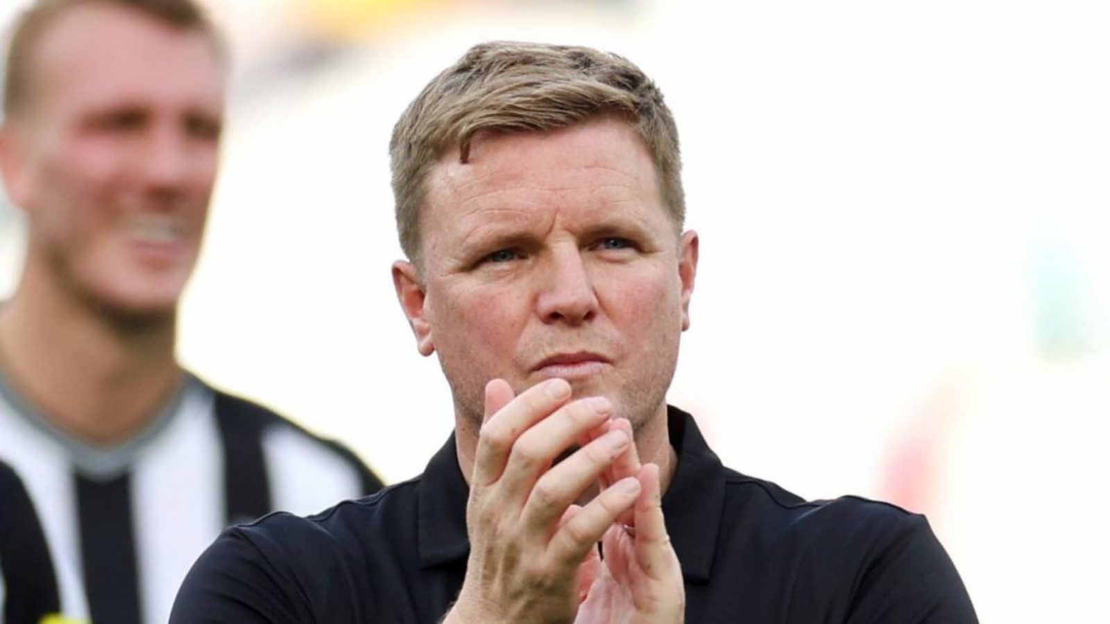 Head coach Eddie Howe applauds the Newcastle United fans.