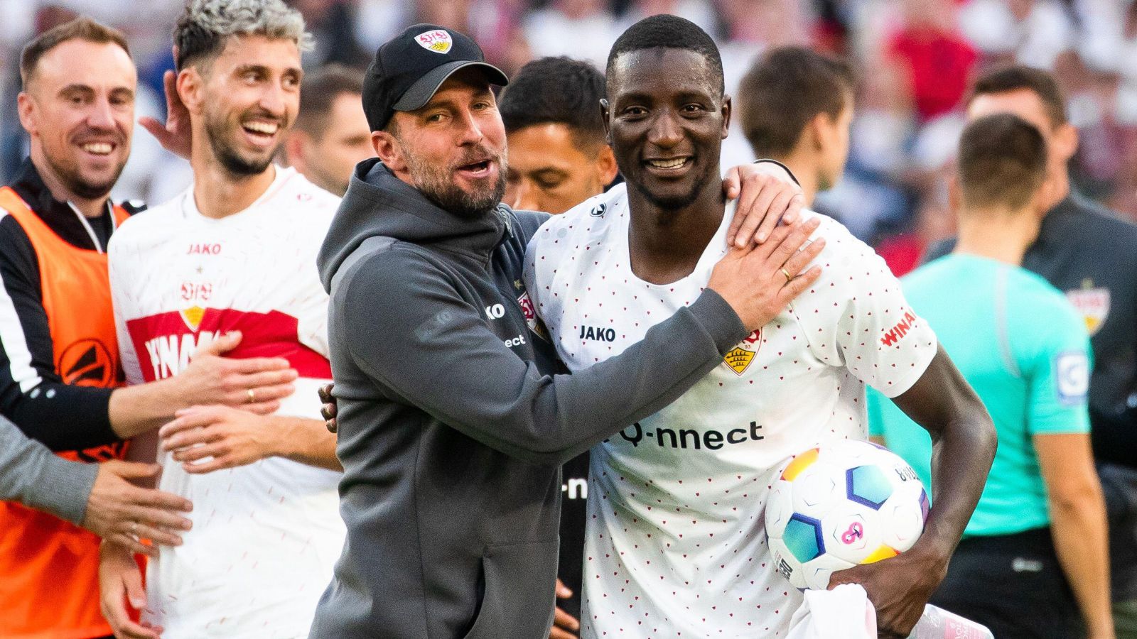 Manchester United-linked Stuttgart striker Serhou Guirassy celebrates with his manager after scoring a hat-trick.