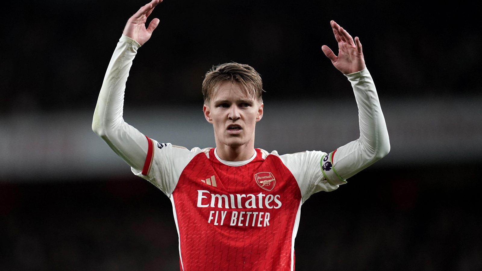 Martin Odegaard celebrates a win.