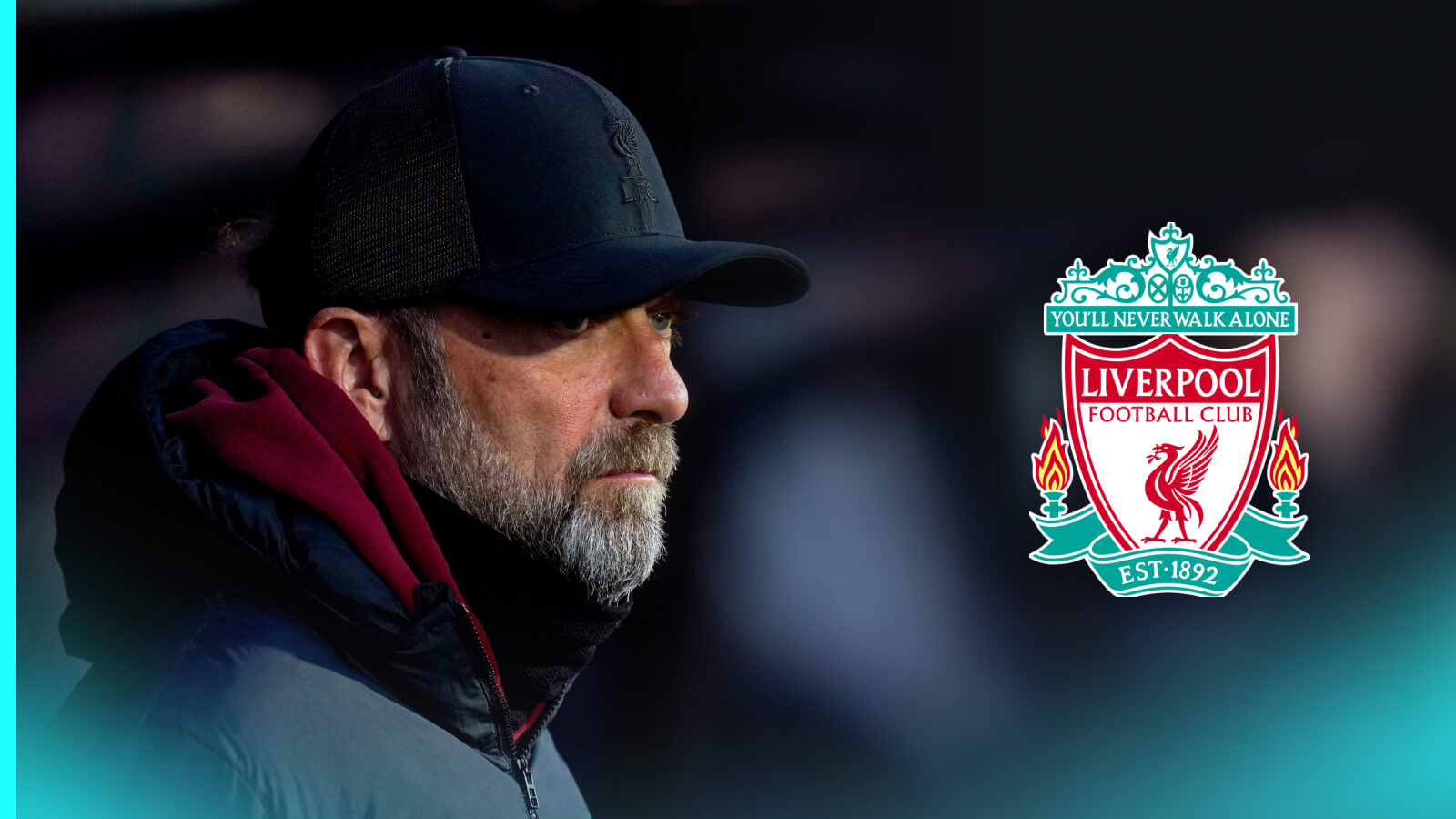 Jurgen Klopp watches on from the touchline with a prominent Liverpool badge alongside him