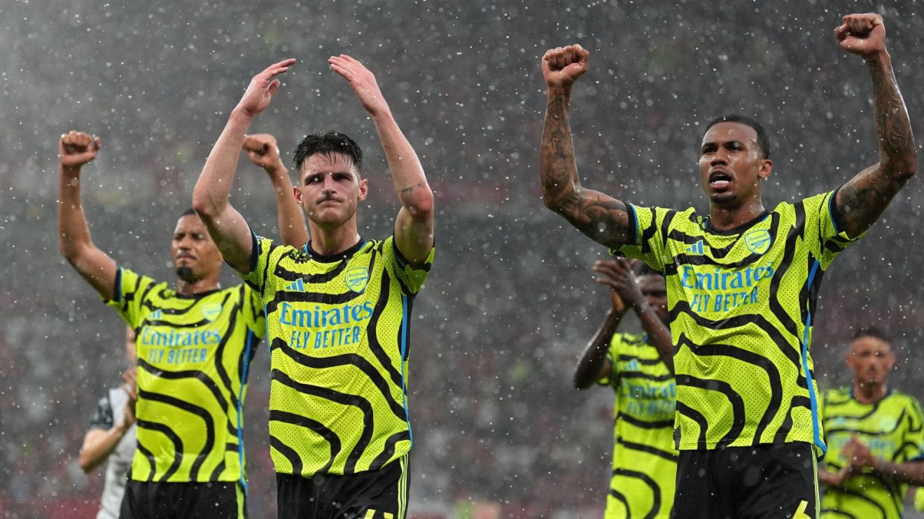 Arsenal celebrate in the rain.
