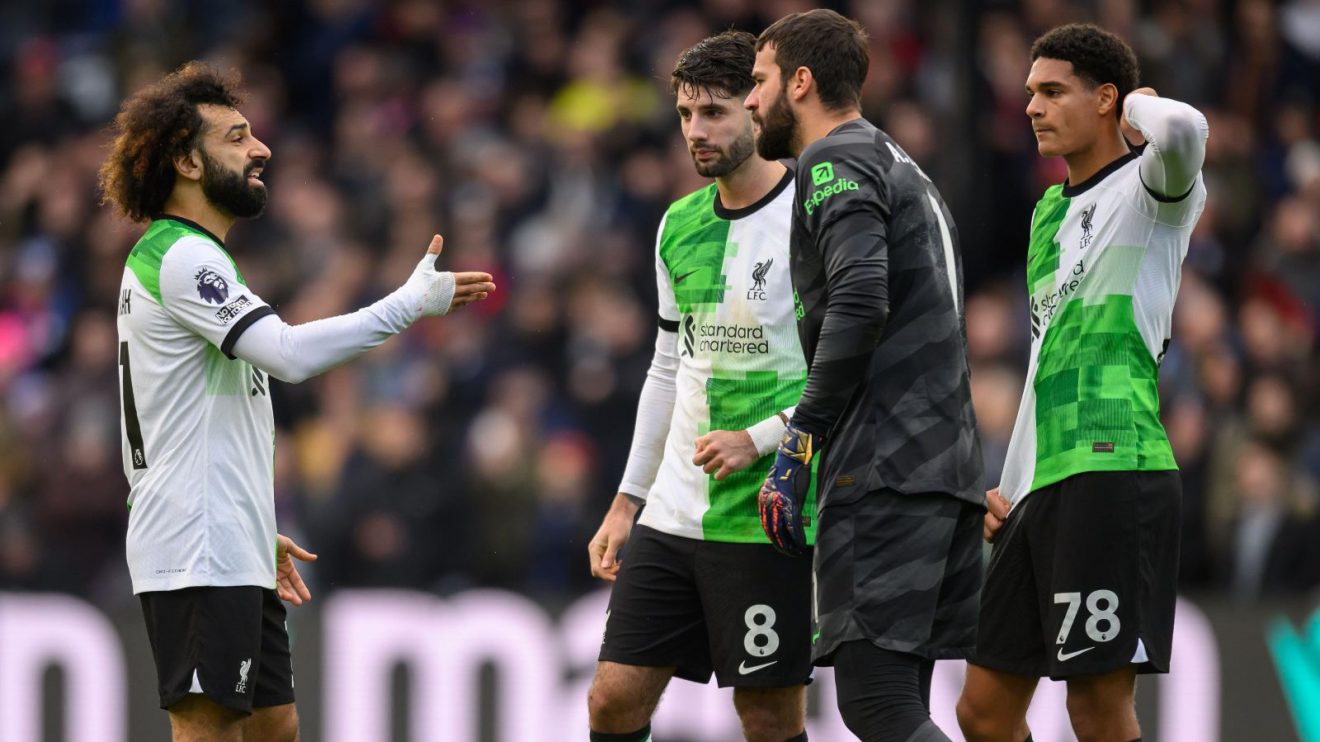 Liverpool players Mohamed Salah and Alisson in discussion during a match