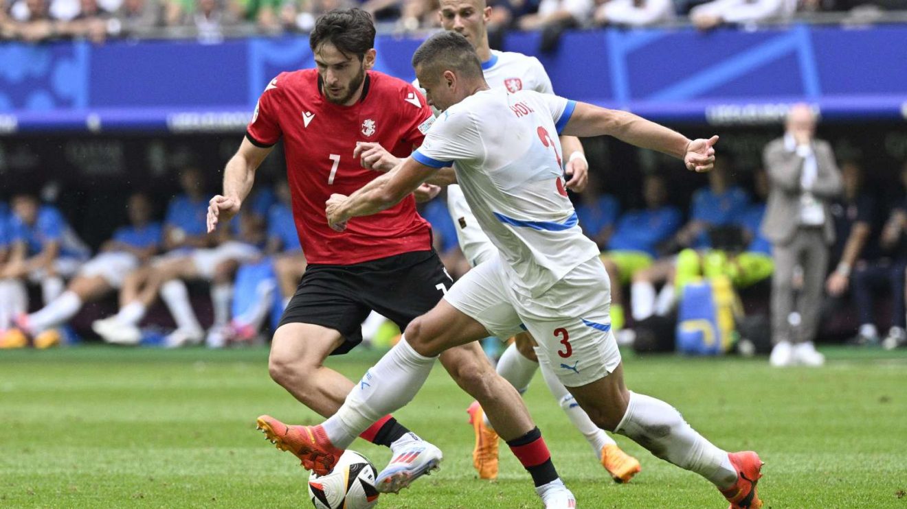 Khvicha Kvaratskhelia and Tomas Holes in action during the Group F match of Euro 2024