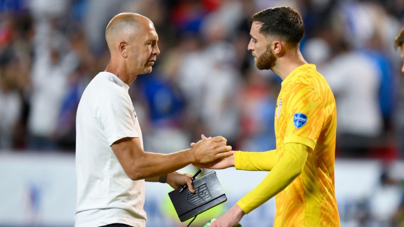 UMSNT head coach Gregg Berhalter shakes hands with Matt Turner