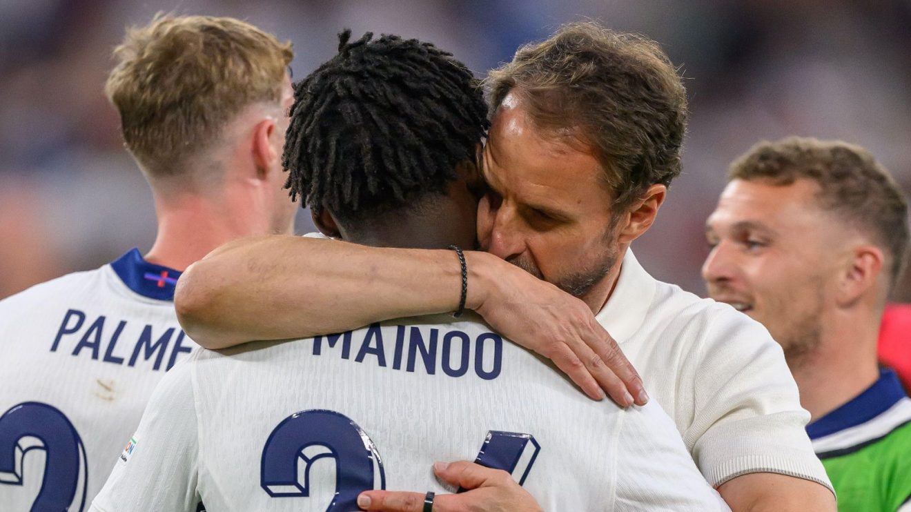 Kobbie Mainoo is embraced by England manager Gareth Southgate