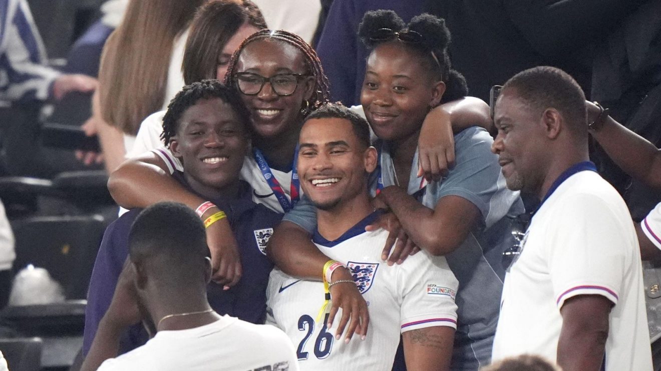 England midfielder Kobbie Mainoo celebrates with his family