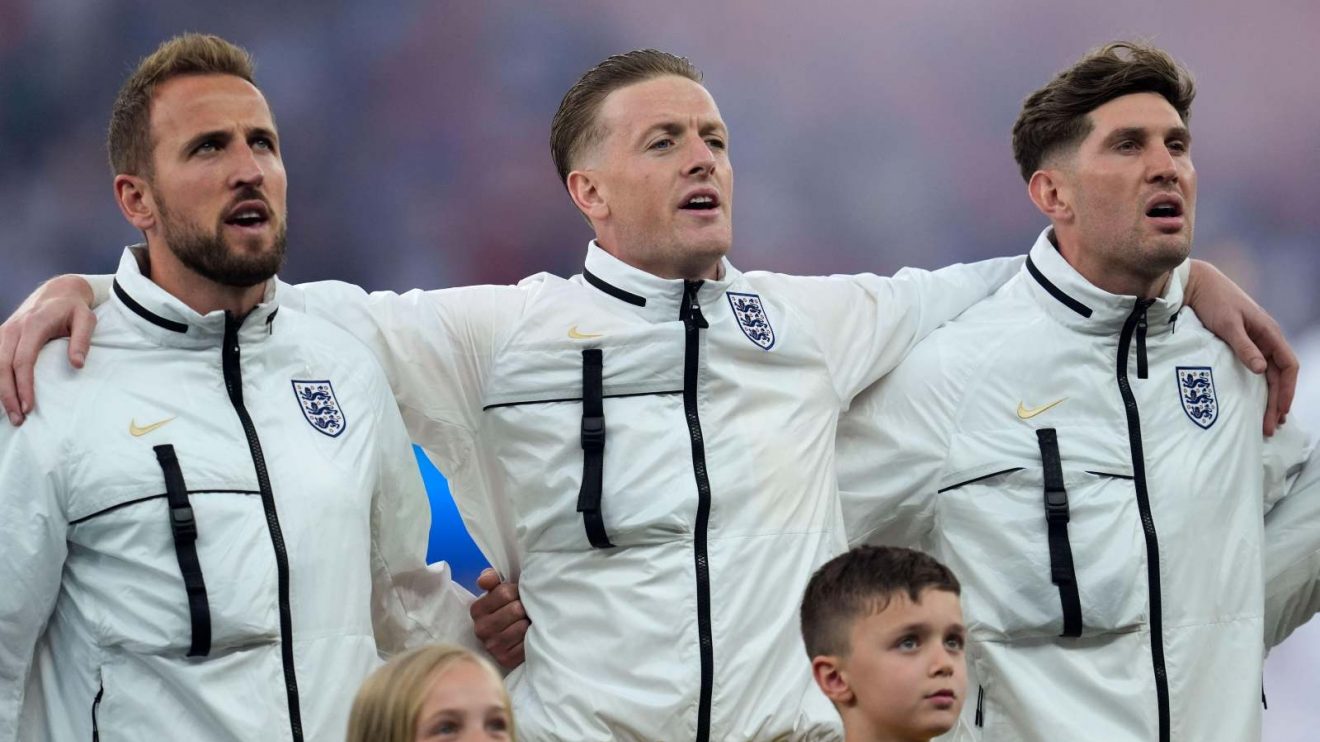 England players Harry Kane, Jordan Pickford and John Stones sing the national anthem