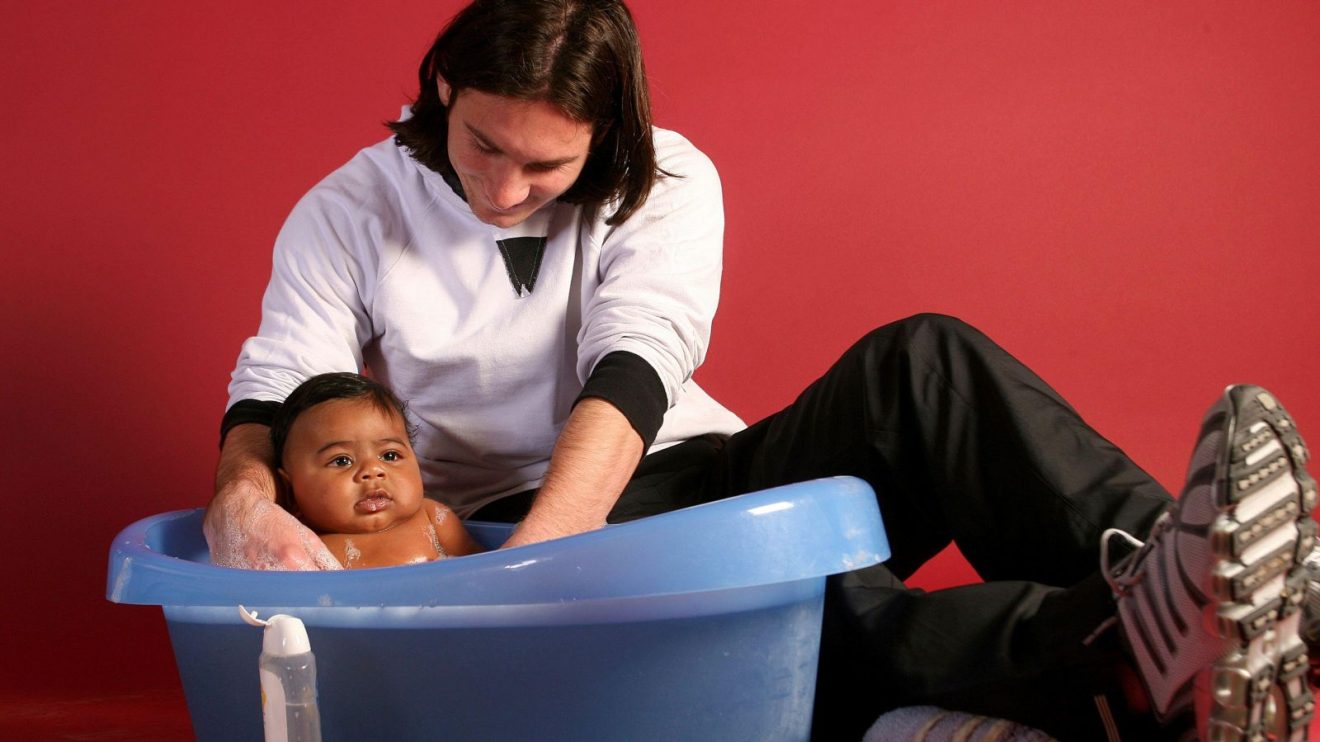 Lionel Messi gives a six-month-old Yamine Lamal a bath