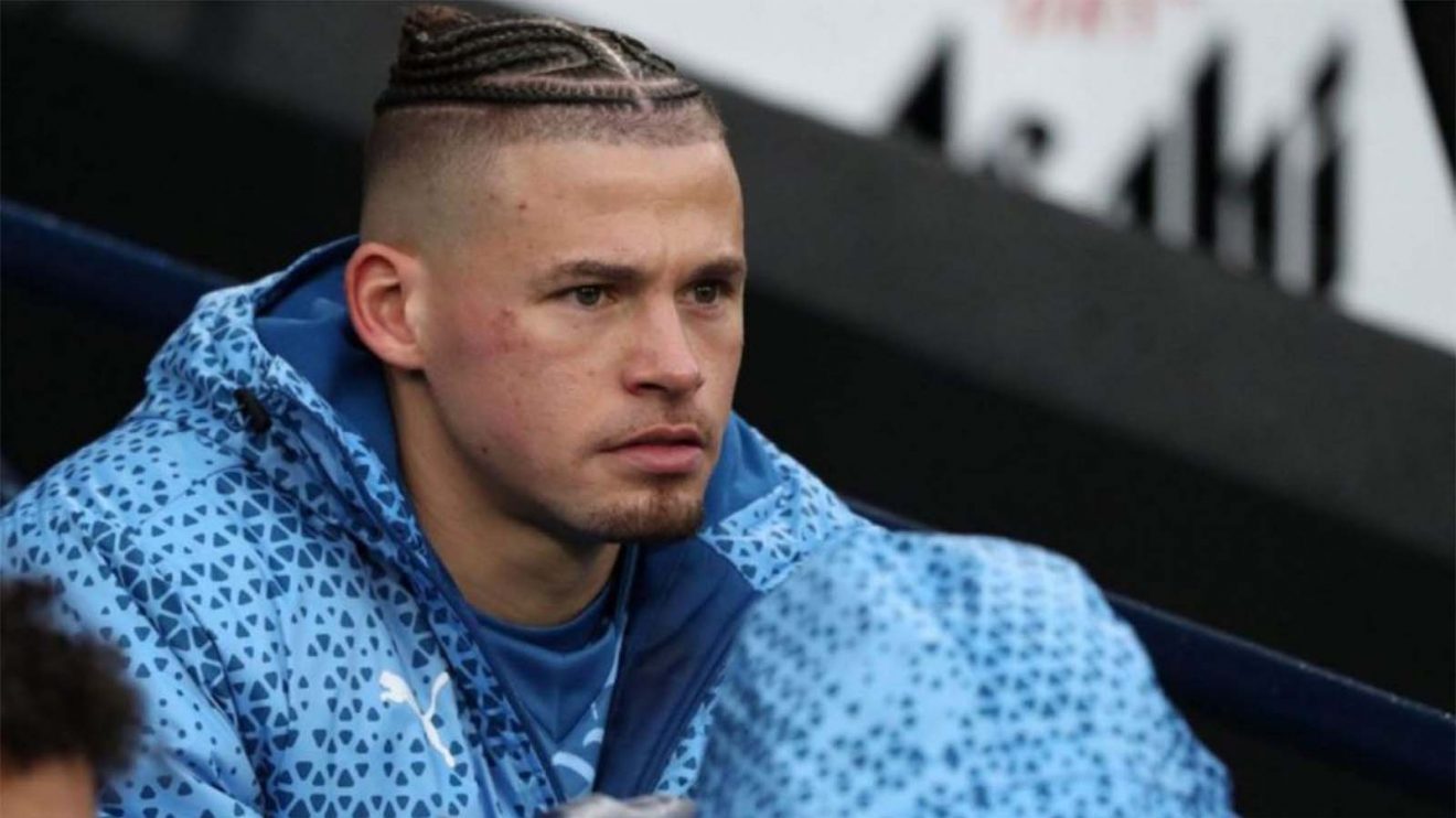 Kalvin Phillips of Man City looks on from the bench