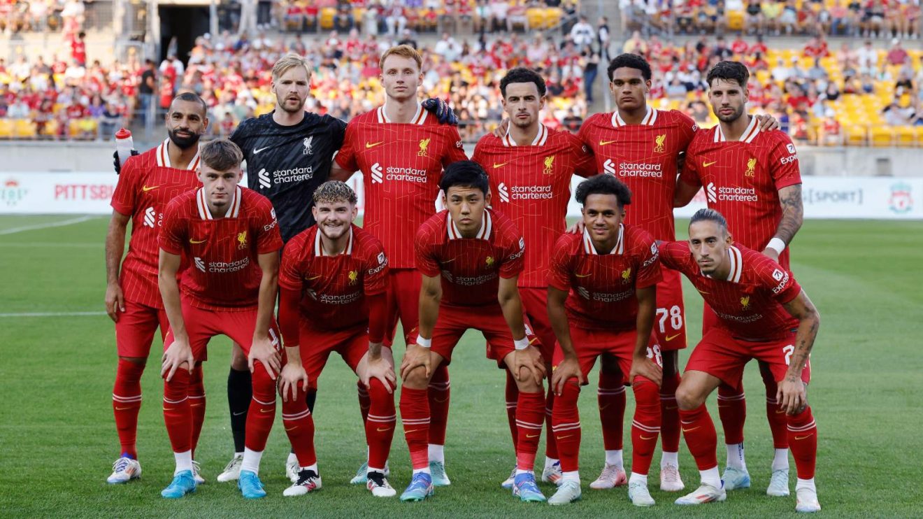 Liverpool players line up before a friendly against Real Betis
