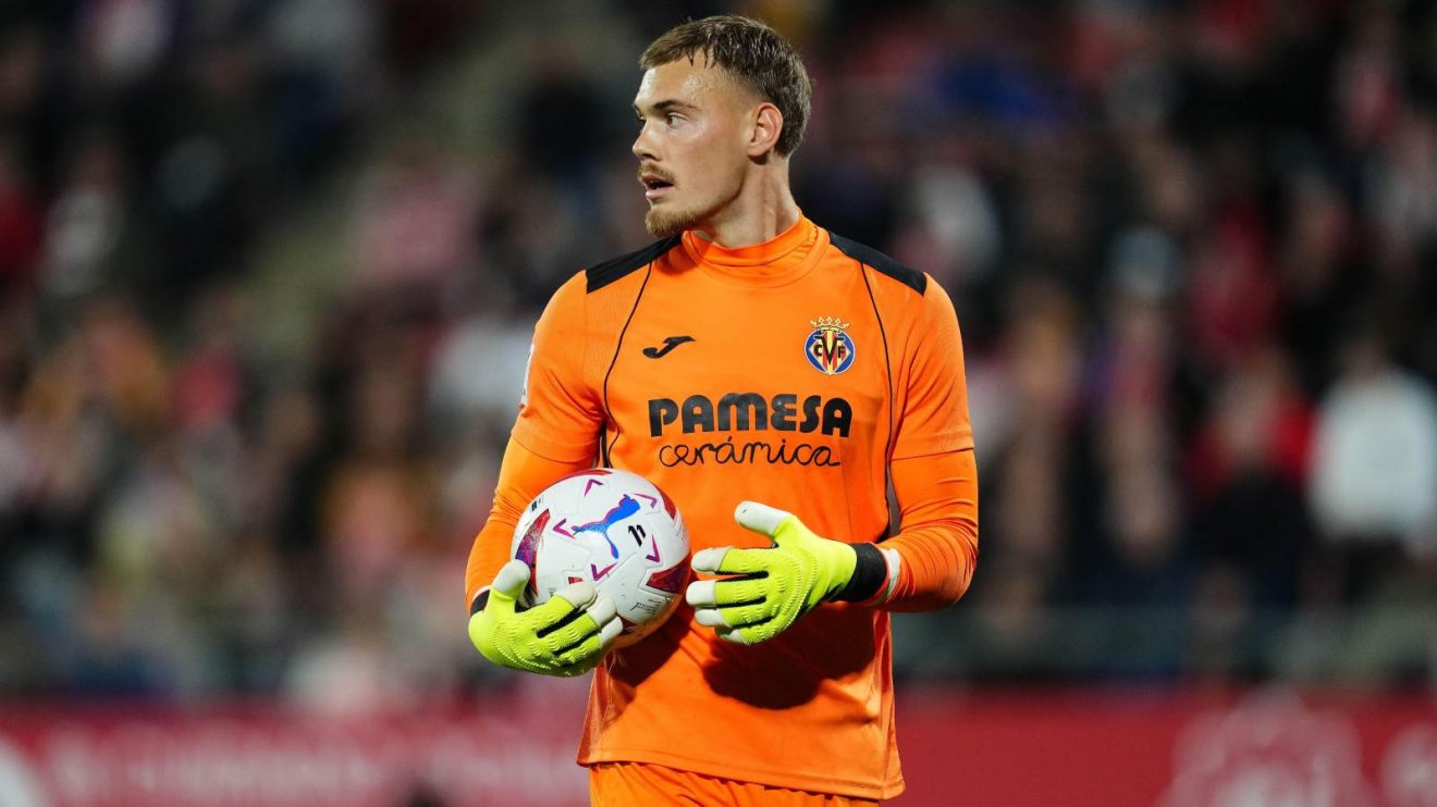 Chelsea target Filip Jorgensen holds onto the ball during a match