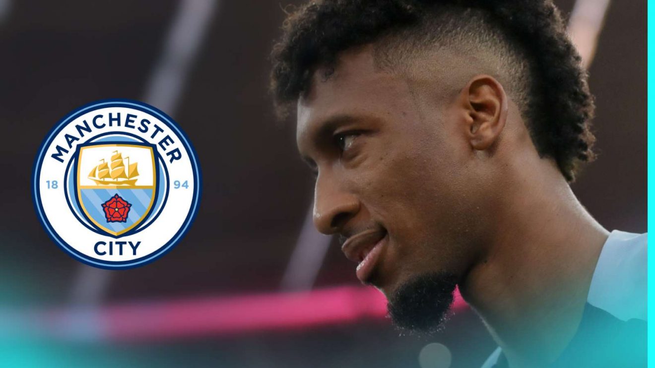 Kingsley Coman with the Man City badge