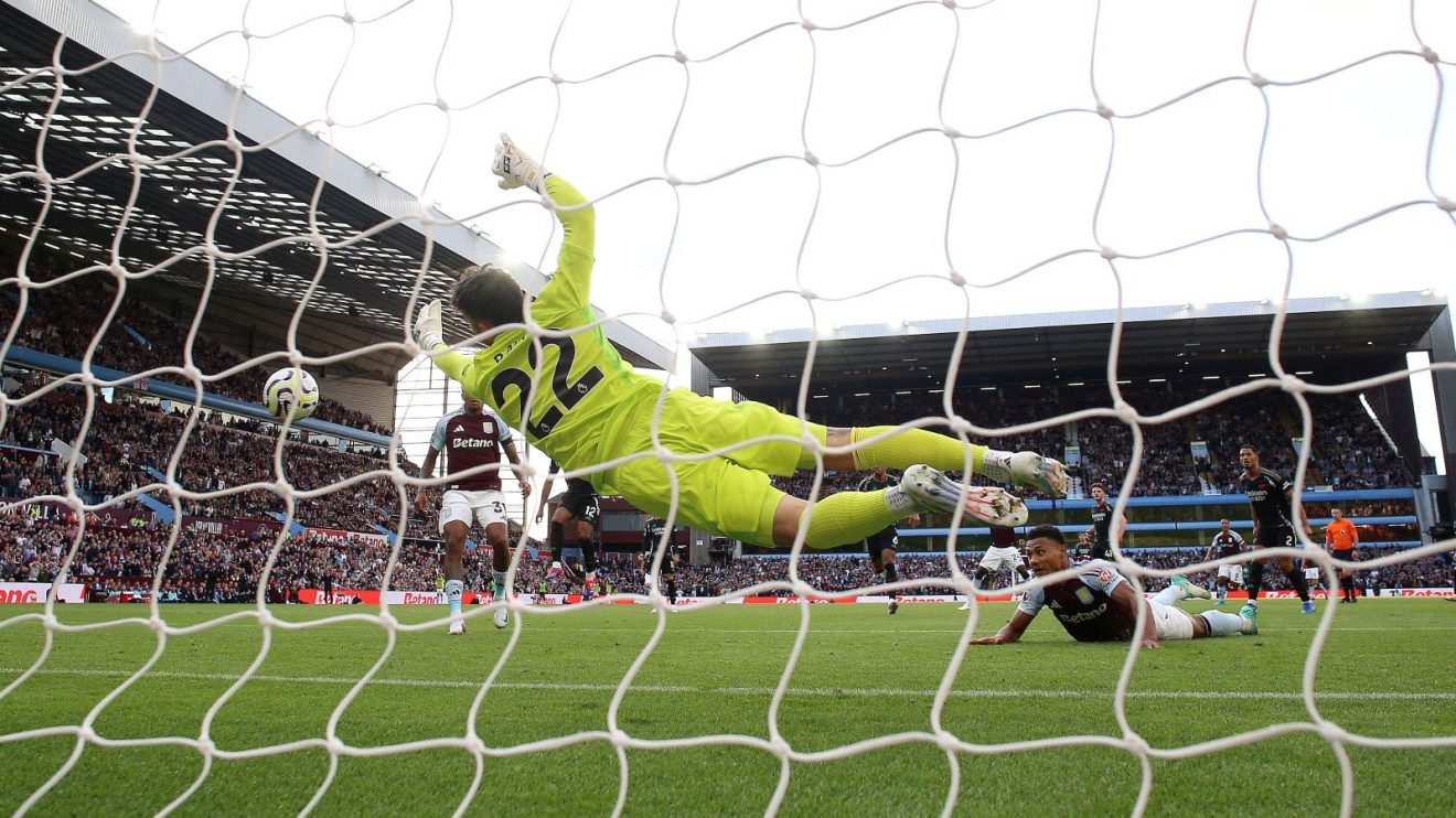 Arsenal goalkeeper David Raya saves from Aston Villa striker Ollie Watkins