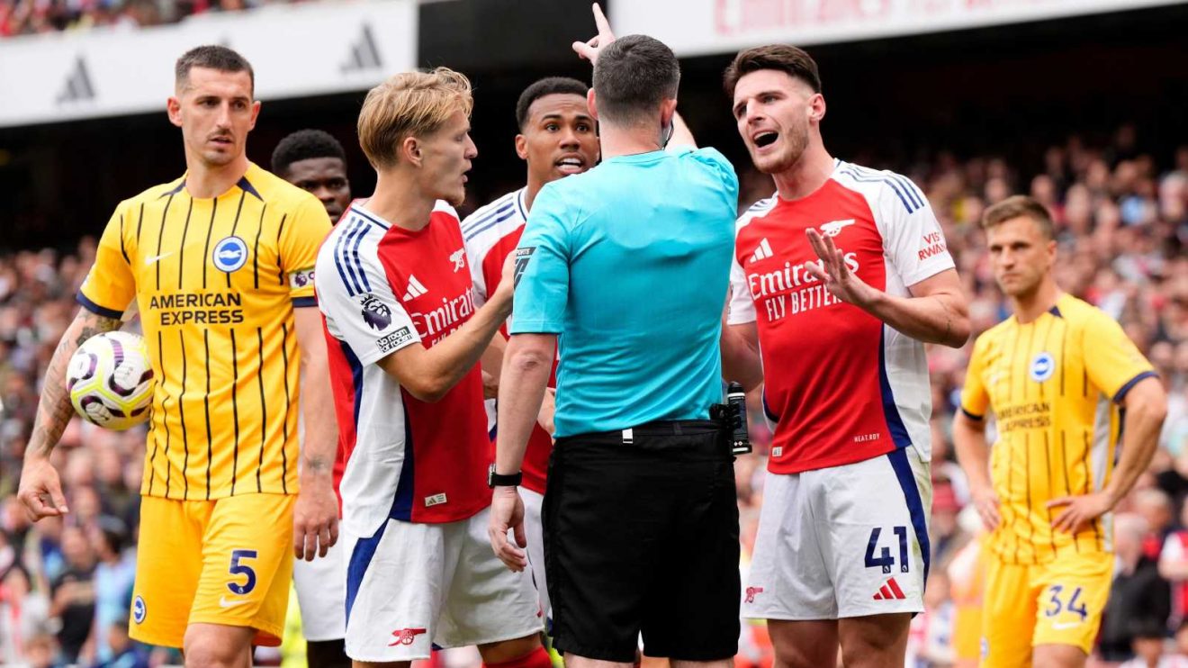 Arsenal midfielder Declan Rice protests to the referee after receiving a red card