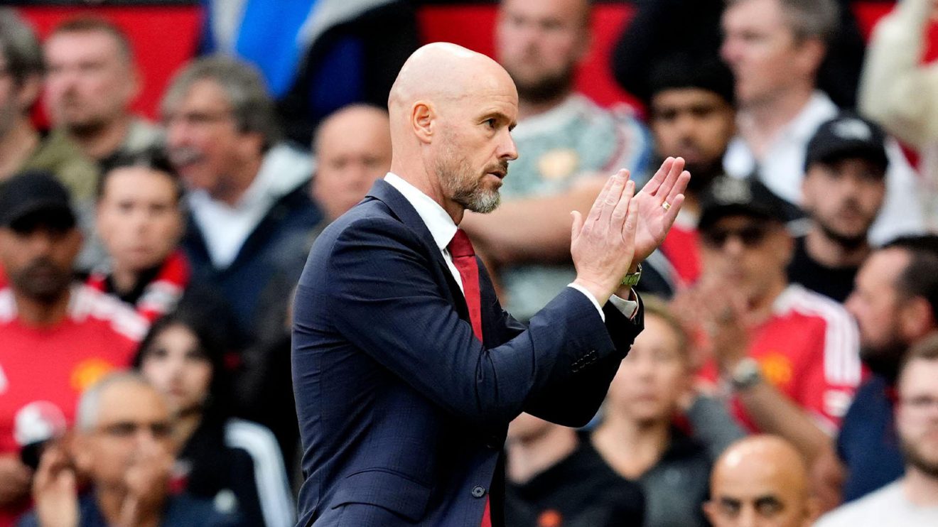 A grim-faced Erik ten Hag applauds the fans following Manchester United's loss to Liverpool