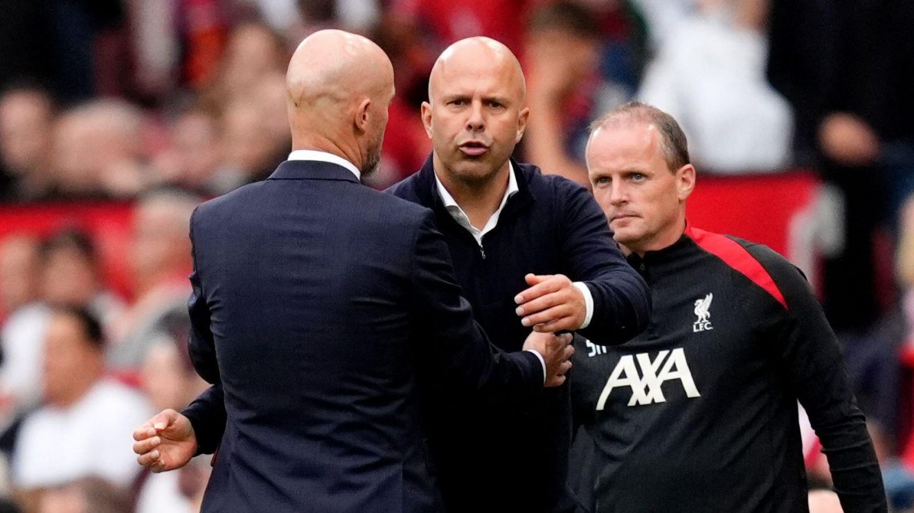 Manchester United manager Erik ten Hag embraces Liverpool head coach Arne Slot