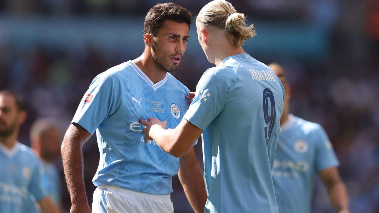 Man City pair Rodri and Erling Haaland during a match