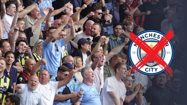 Man City fans with a crossed badge