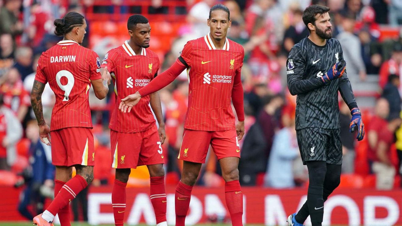 Liverpool players Alisson and Virgil van Dijk complain after conceding a goal