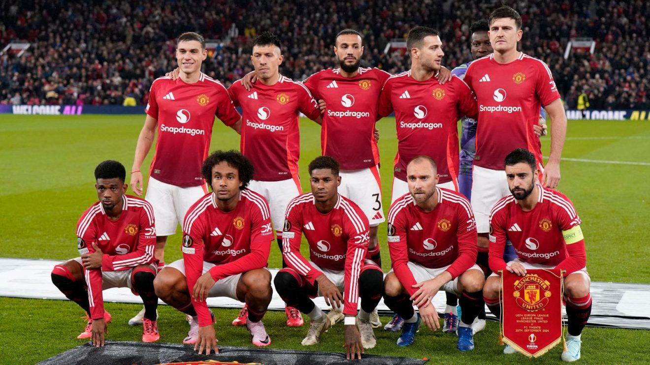 Manchester United players line up before a Europa League game with Twente