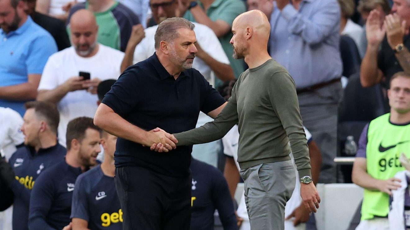 Spurs manager Ange Postecoglou shakes hands with Manchester United coach Erik ten Hag