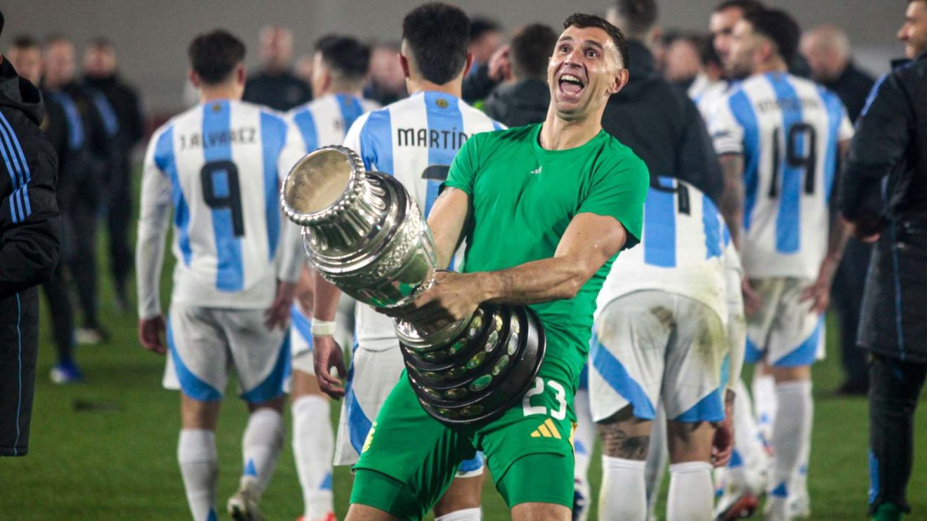 Emiliano Martinez celebrates with the Copa America trophy