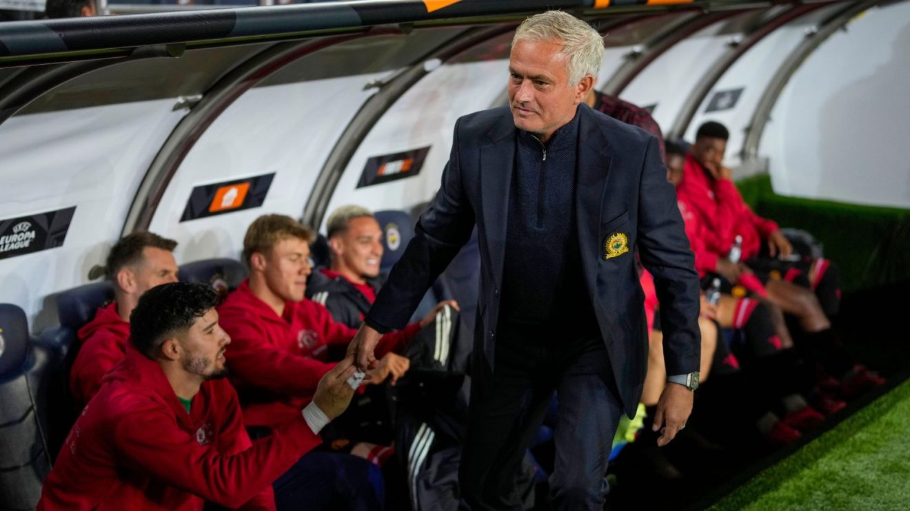 Fenerbahce head coach Jose Mourinho embraces Man Utd players
