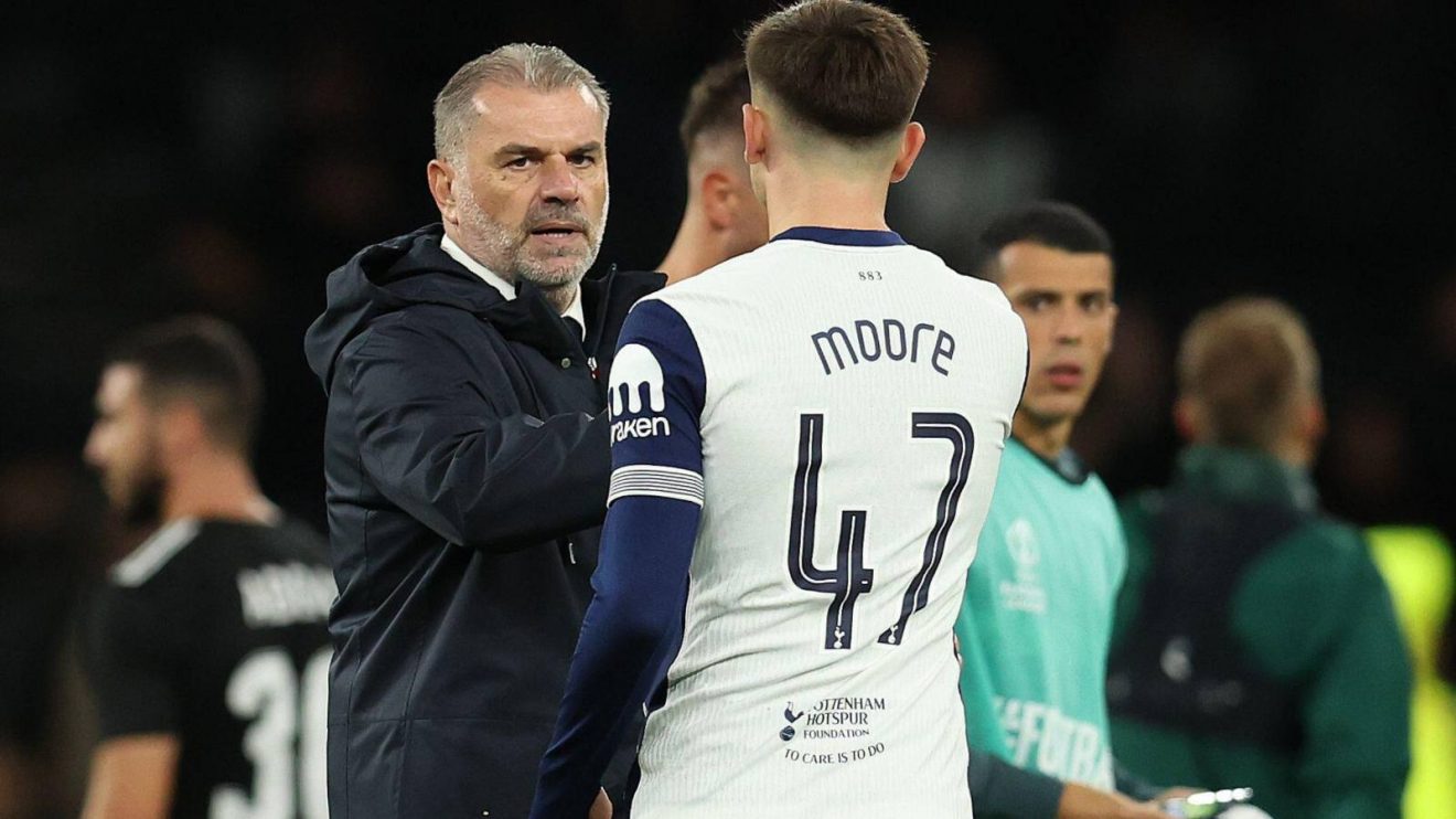 Tottenham boss Ange Postecoglou shakes hands with Mikey Moore
