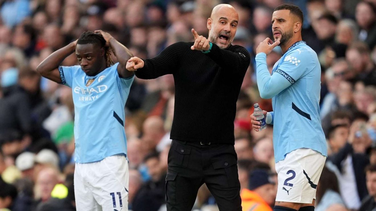 Pep Guardiola gives instructions to his players