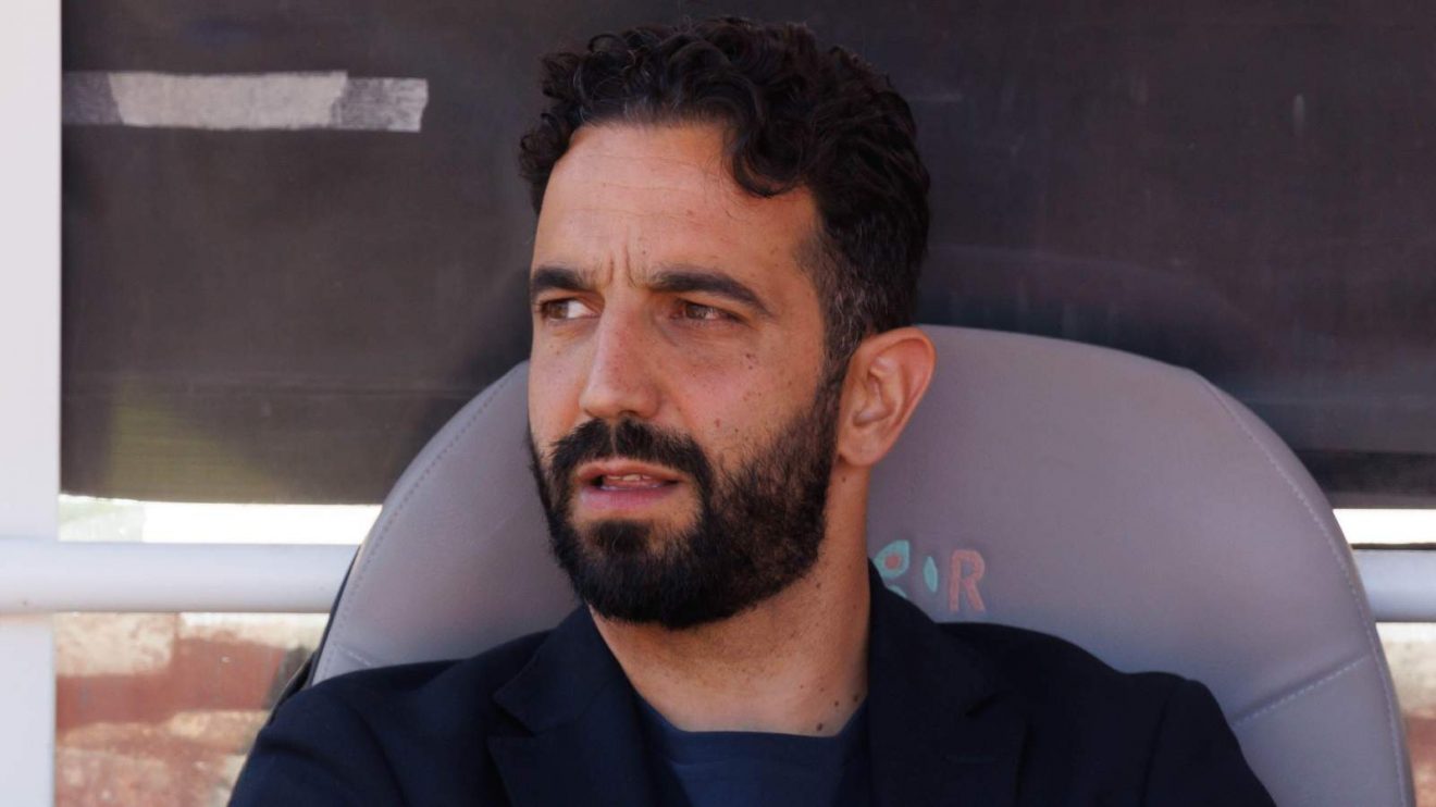 Man Utd manager target Ruben Amorim sits on the bench before a game
