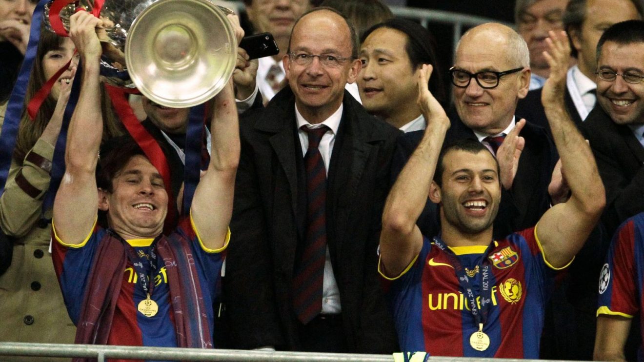 Lionel Messi and Javier Mascherano celebrate winning the Champions League