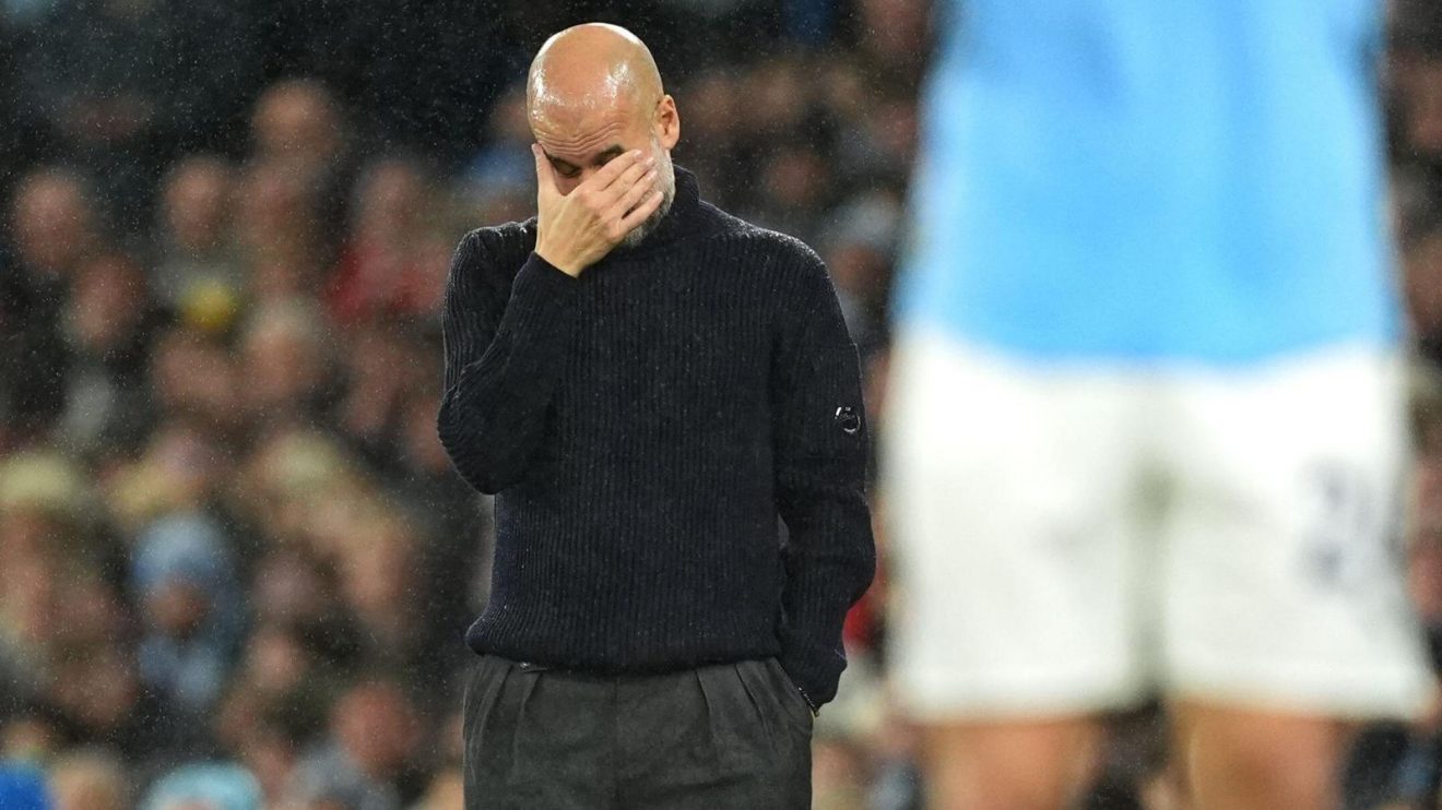 Man City manager Pep Guardiola looks dejected during a match