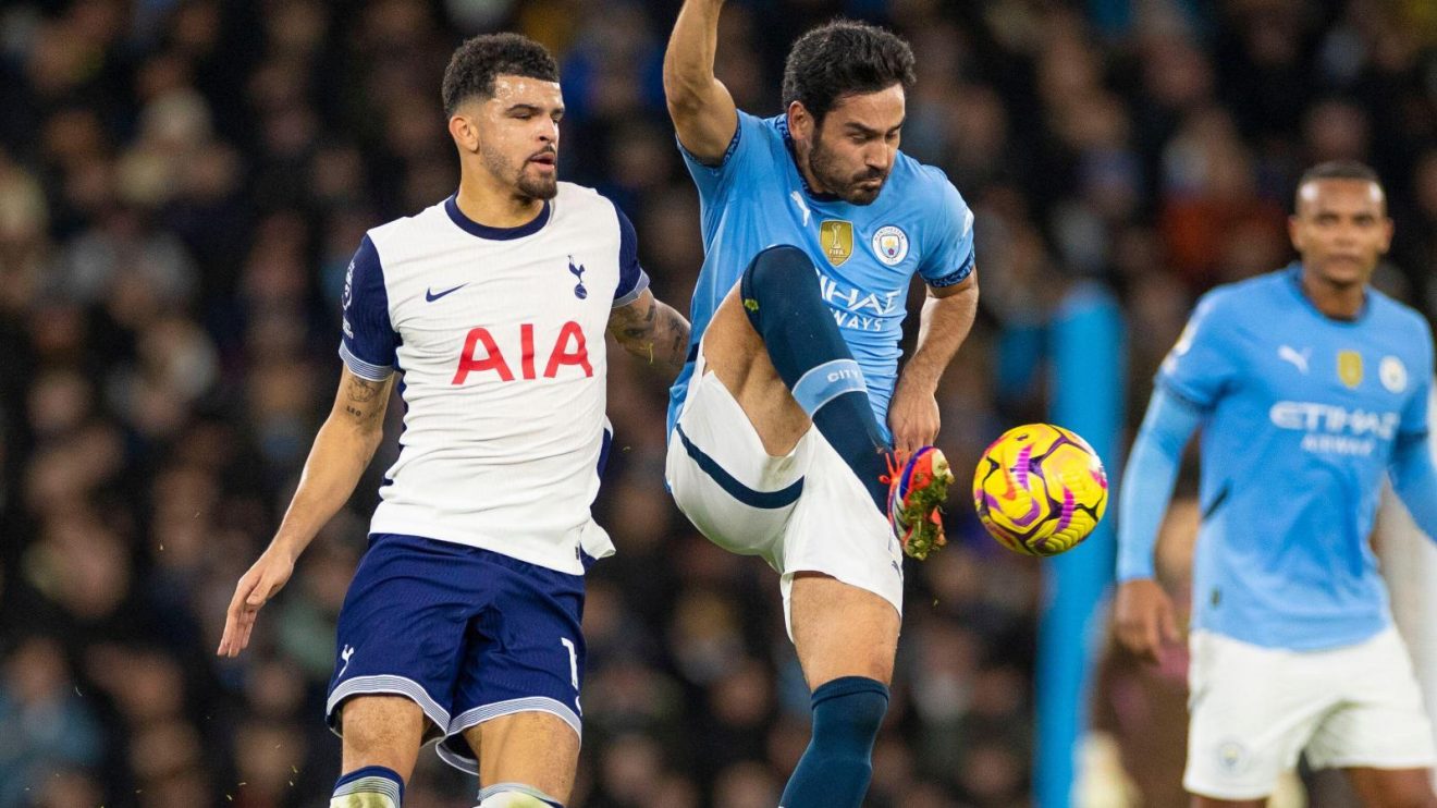 Man City midfielder Ilkay Gundogan controls the ball during a match