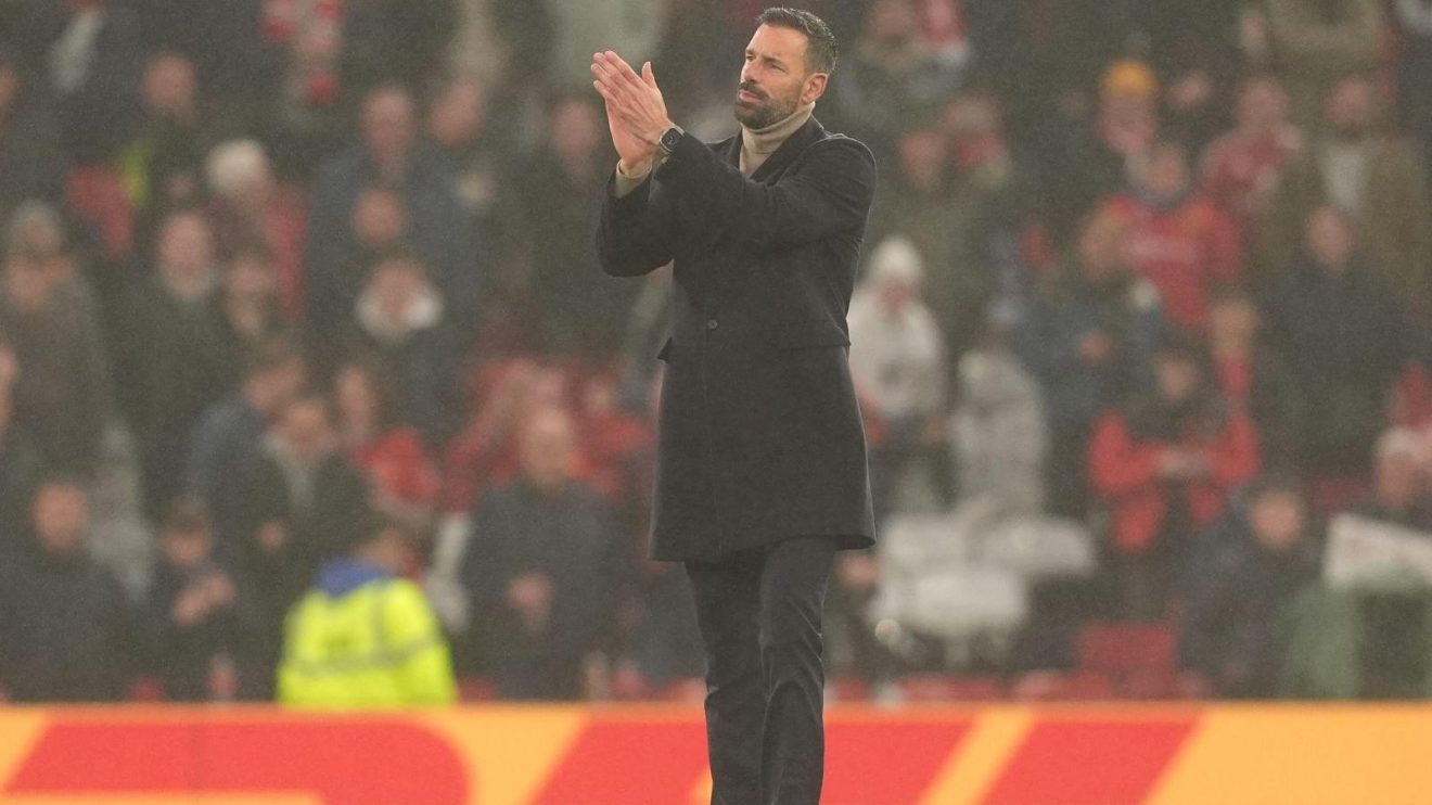 New Leicester City manager Ruud van Nistelrooy applauds the Man Utd fans