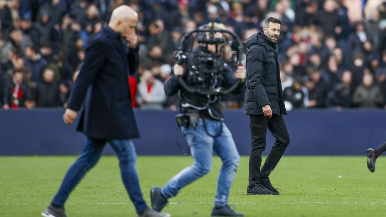 PSV coach Ruud van Nistelrooy with Feyenoord manager Arne Slot in the foreground