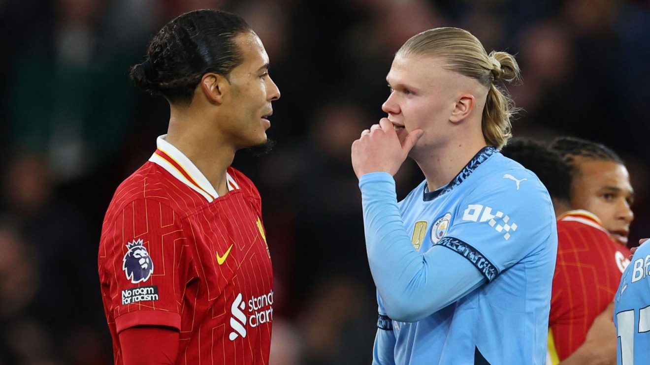 Liverpool defender Virgil van Dijk talks to Manchester City striker Erling Haaland