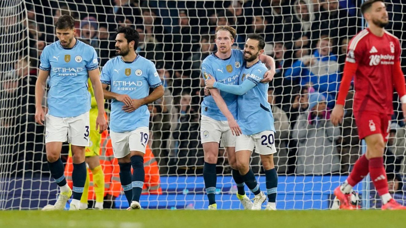 Man City goalscorers Kevin De Bruyne and Bernardo Silva celebrate during a 3-0 win over Nottingham Forest